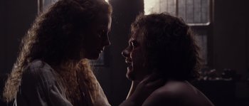 Movie still from “Nightwatching” (2007), directed by Peter Greenaway – A man and a woman looking into each others eyes; Close Up shot, Low angle