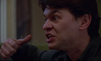 Movie still from “Nil by Mouth” (1997), directed by Gary Oldman – A person talking to someone; Close Up shot, Low angle