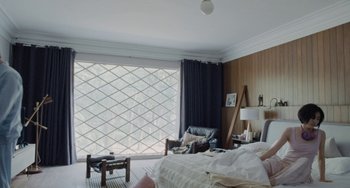 Movie still from “Nimic” (2019), directed by Yorgos Lanthimos – A bed room with a bed a chair and a window; Wide shot, High angle