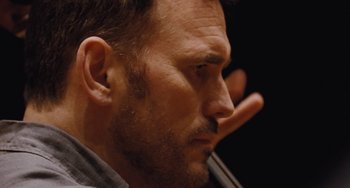 Movie still from “Nimic” (2019), directed by Yorgos Lanthimos – A person with a beard; Extreme Close Up shot, Low angle