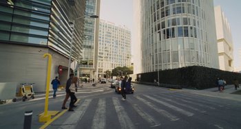 Movie still from “Nimic” (2019), directed by Yorgos Lanthimos – A group of people walking across a street in a city; Extreme Wide shot, High angle
