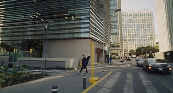 Movie still from “Nimic” (2019), directed by Yorgos Lanthimos – A man walking down the street holding a skateboard; Extreme Wide shot, High angle