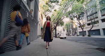 Movie still from “Nimic” (2019), directed by Yorgos Lanthimos – A woman walking down the street wearing a coat; Wide shot, Low angle