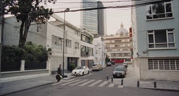 Movie still from “Nimic” (2019), directed by Yorgos Lanthimos – A man is crossing the street in the middle of the day; Extreme Wide shot, High angle