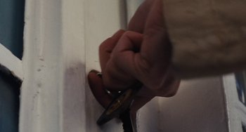Movie still from “Nimic” (2019), directed by Yorgos Lanthimos – A person holding a pair of scissors in their hand; Extreme Close Up shot, High angle