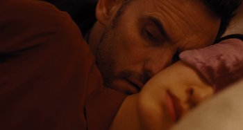 Movie still from “Nimic” (2019), directed by Yorgos Lanthimos – A person sleeping on a bed; Extreme Close Up shot, Overhead angle