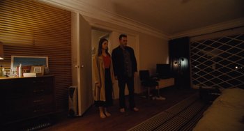 Movie still from “Nimic” (2019), directed by Yorgos Lanthimos – A man and a woman standing in a living room; Wide shot, High angle