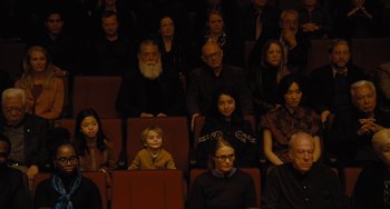Movie still from “Nimic” (2019), directed by Yorgos Lanthimos – A group of people sitting in rows in a theater; Wide shot, High angle