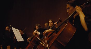 Movie still from “Nimic” (2019), directed by Yorgos Lanthimos – A group of people that are playing some instruments; Medium shot, Low angle