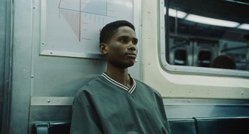 Movie still from “Nimic” (2019), directed by Yorgos Lanthimos – A man standing in front of a subway train; Close Up shot, Low angle