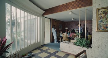 Movie still from “Nimic” (2019), directed by Yorgos Lanthimos – A group of people sitting in a room; Wide shot, High angle