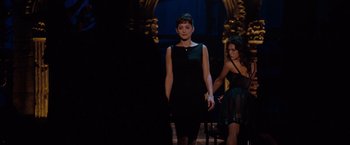 Movie still from “Nine” (2009), directed by Rob Marshall – A woman in a black dress standing next to another woman in a black dress; Medium shot, Over the shoulder angle