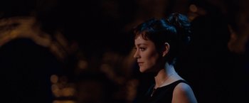 Movie still from “Nine” (2009), directed by Rob Marshall – A person wearing a black dress; Close Up shot, Over the shoulder angle