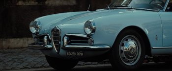 Movie still from “Nine” (2009), directed by Rob Marshall – The headlight of an old car; Close Up shot, Low angle