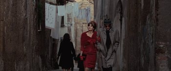 Movie still from “Nine” (2009), directed by Rob Marshall – A man and a woman walking down a street; Medium shot, Over the shoulder angle