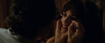 Movie still from “Nine” (2009), directed by Rob Marshall – A person putting makeup on her face; Close Up shot, Over the shoulder angle