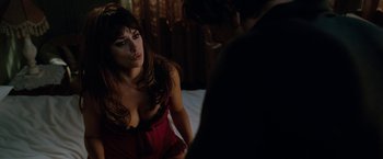 Movie still from “Nine” (2009), directed by Rob Marshall – A woman sitting on a bed next to a man; Close Up shot, High angle