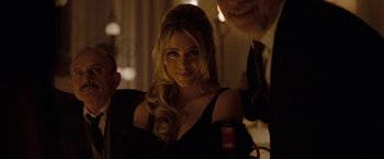 Movie still from “Nine” (2009), directed by Rob Marshall – A beautiful woman in a black dress and a man in a black suit; Close Up shot, Over the shoulder angle