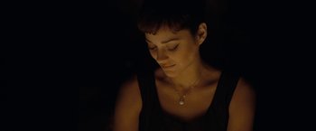 Movie still from “Nine” (2009), directed by Rob Marshall – A person wearing a necklace; Close Up shot, High angle