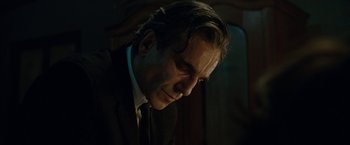 Movie still from “Nine” (2009), directed by Rob Marshall – A person wearing a suit and tie; Close Up shot, Low angle