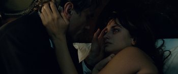 Movie still from “Nine” (2009), directed by Rob Marshall – A man and a woman in a dark room; Close Up shot, High angle