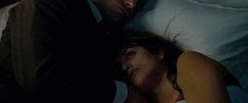 Movie still from “Nine” (2009), directed by Rob Marshall – A man and a woman laying in a bed together; Close Up shot, Overhead angle