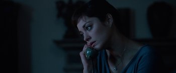 Movie still from “Nine” (2009), directed by Rob Marshall – A woman is talking on the phone in the dark; Close Up shot, High angle