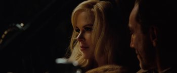Movie still from “Nine” (2009), directed by Rob Marshall – A woman with blonde hair and blue eyes looking to her left; Close Up shot, Over the shoulder angle