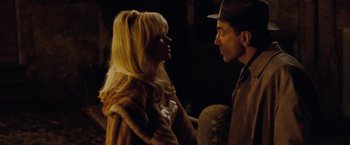 Movie still from “Nine” (2009), directed by Rob Marshall – A man and a woman are talking to each other; Close Up shot, Over the shoulder angle