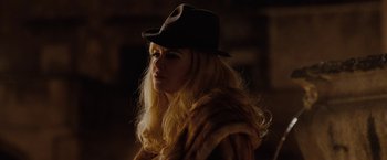 Movie still from “Nine” (2009), directed by Rob Marshall – A woman with long blonde hair wearing a black hat; Close Up shot, Low angle