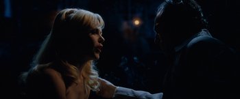 Movie still from “Nine” (2009), directed by Rob Marshall – A man and a woman talking in a dark room; Close Up shot, Over the shoulder angle