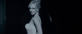 Movie still from “Nine” (2009), directed by Rob Marshall – A black and white photo of a woman in a white dress; Close Up shot, Low angle