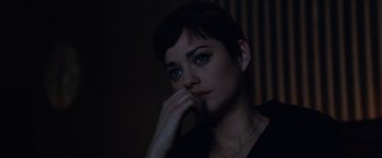Movie still from “Nine” (2009), directed by Rob Marshall – A person with short black hair; Close Up shot, Over the shoulder angle