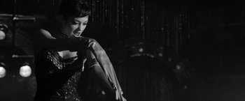 Movie still from “Nine” (2009), directed by Rob Marshall – A black and white photo of a woman dancing; Medium shot, Low angle