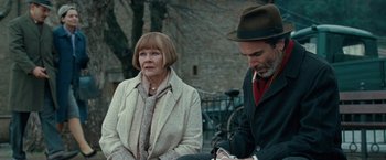 Movie still from “Nine” (2009), directed by Rob Marshall – A man and a woman sitting next to each other on a bench; Medium shot, Over the shoulder angle