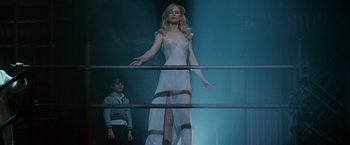 Movie still from “Nine” (2009), directed by Rob Marshall – A woman in a white dress standing next to another woman; Wide shot, Low angle