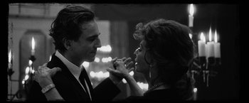 Movie still from “Nine” (2009), directed by Rob Marshall – A man and a woman are holding hands and looking at each other; Close Up shot, Low angle