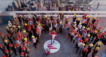 Movie still from “Nine Lives” (2016), directed by Barry Sonnenfeld – A group of people standing on top of a building; Extreme Wide shot, High angle