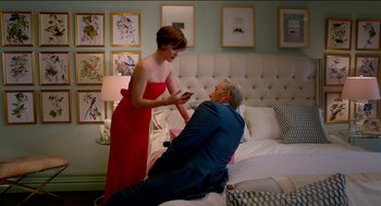 Movie still from “Nine Lives” (2016), directed by Barry Sonnenfeld – An older man laying on a bed next to an older woman; Medium shot, Over the shoulder angle