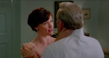 Movie still from “Nine Lives” (2016), directed by Barry Sonnenfeld – A man and a woman are looking at one another; Close Up shot, Over the shoulder angle