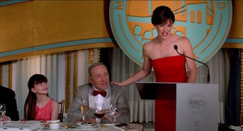 Movie still from “Nine Lives” (2016), directed by Barry Sonnenfeld – A man and a woman at a table with a wine glass; Medium shot, Over the shoulder angle