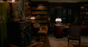 Movie still from “Nine Lives” (2016), directed by Barry Sonnenfeld – A living room filled with furniture next to a fire place; Wide shot, High angle