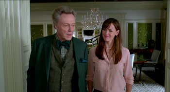 Movie still from “Nine Lives” (2016), directed by Barry Sonnenfeld – A man and a woman standing next to each other in a room; Medium shot, Over the shoulder angle
