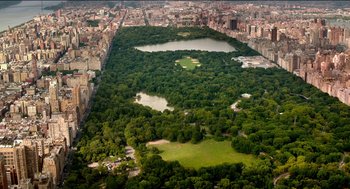 Movie still from “Nine Lives” (2016), directed by Barry Sonnenfeld – An aerial view of a large park in the middle of a city; Extreme Wide shot, High angle