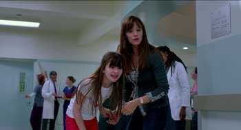 Movie still from “Nine Lives” (2016), directed by Barry Sonnenfeld – A woman standing next to a young girl in a room; Medium shot, Over the shoulder angle