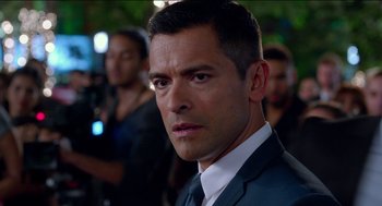 Movie still from “Nine Lives” (2016), directed by Barry Sonnenfeld – A man in a suit and tie; Close Up shot, Over the shoulder angle