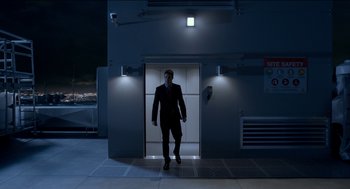 Movie still from “Nine Lives” (2016), directed by Barry Sonnenfeld – A man standing in front of an elevator at night; Extreme Wide shot, Low angle