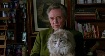 Movie still from “Nine Lives” (2016), directed by Barry Sonnenfeld – An older woman holding a cat in her lap; Close Up shot, Over the shoulder angle
