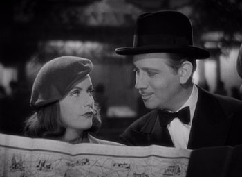 Movie still from “Ninotchka” (1939), directed by Ernst Lubitsch – A man and a woman are looking at each other; Close Up shot, High angle