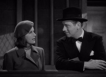 Movie still from “Ninotchka” (1939), directed by Ernst Lubitsch – A man and a woman are talking to each other; Medium shot, Low angle